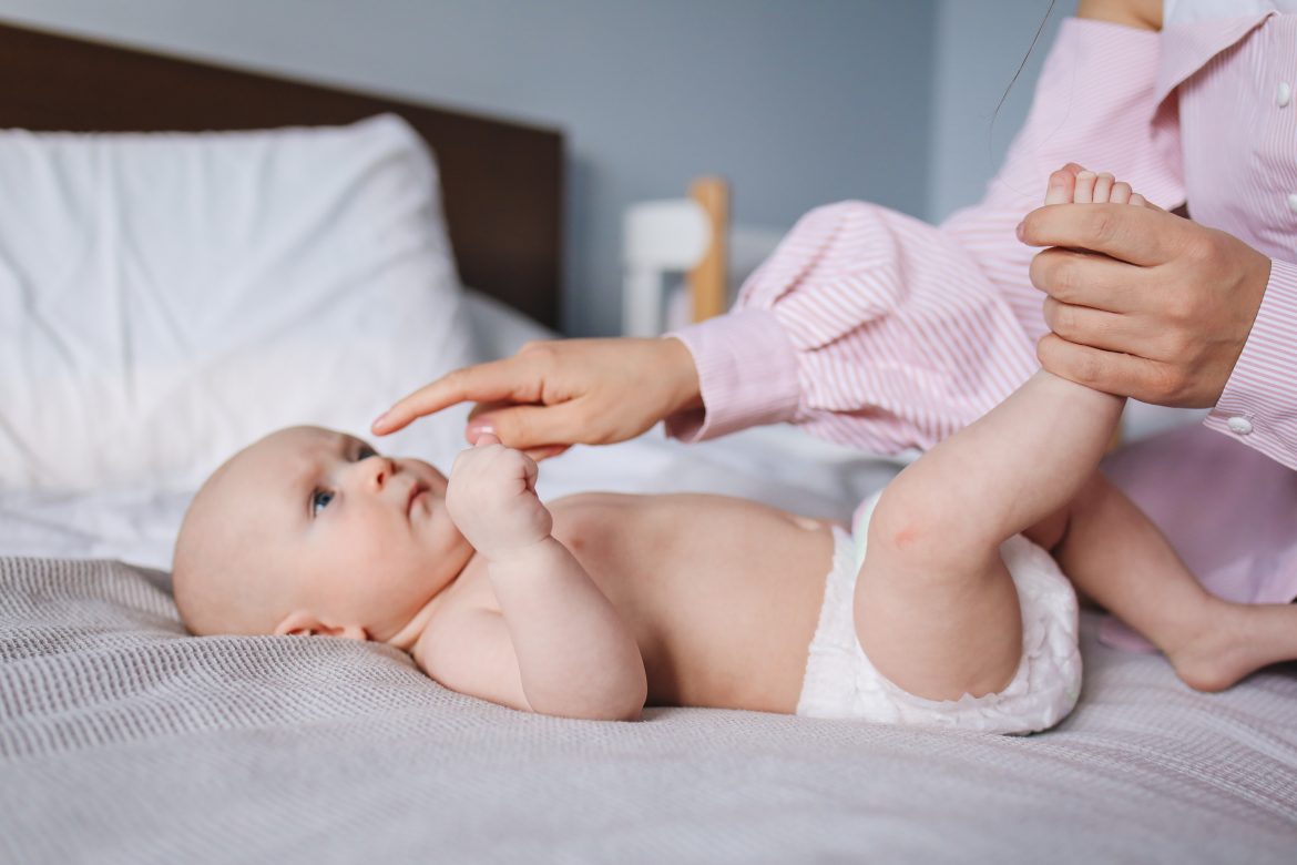crop-mother-playing-with-baby-3875083